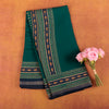 Emerald-green-soft-chanderi-cotton-silk-saree-with-traditional-gold-zari-printed-border.