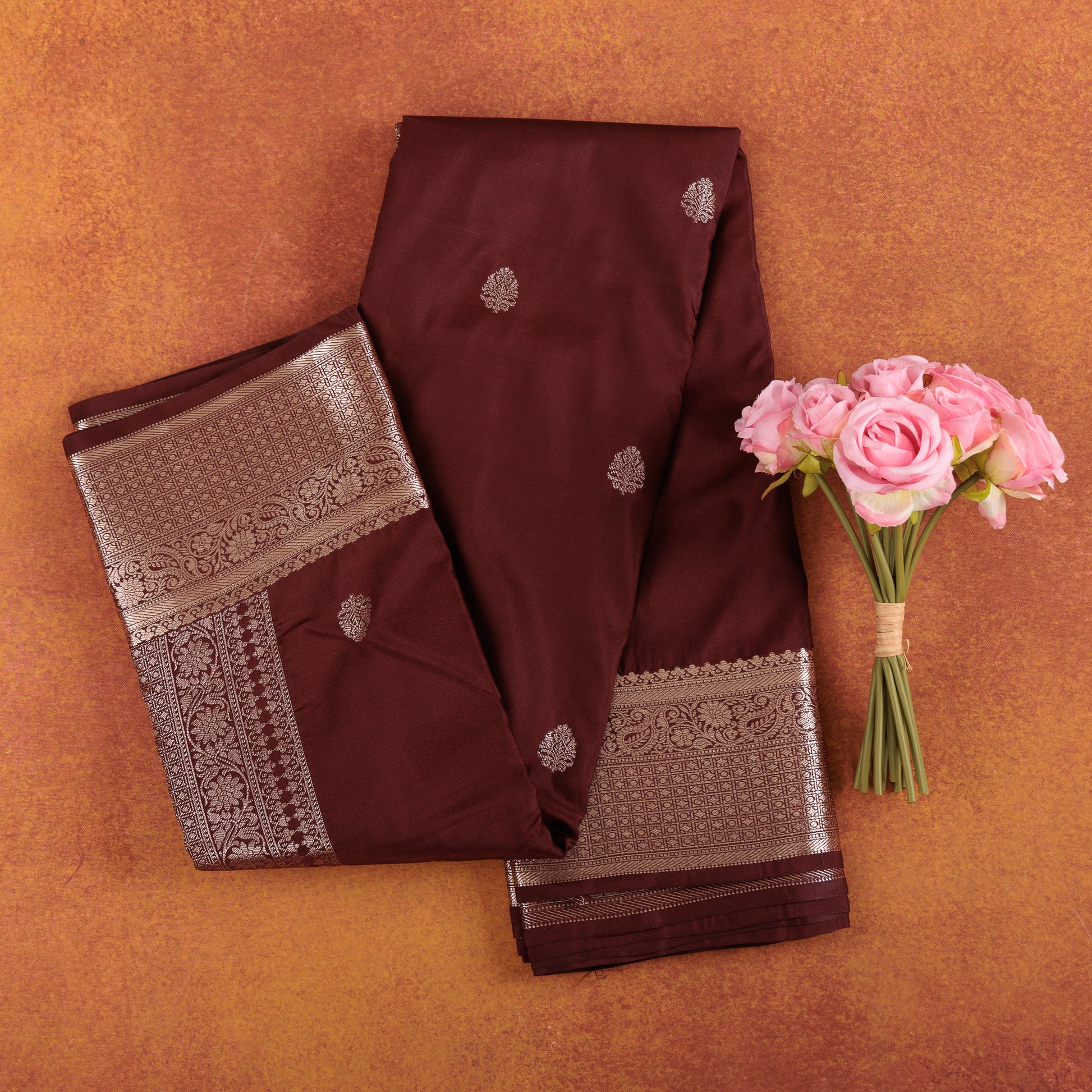 Deep-wine-kanjivaram-crepe-silk-saree-with-silver-zari-border.
