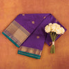 Royal-purple-kanjivaram-semi-silk-saree-with-gold-zari-butis-and-pink-border.