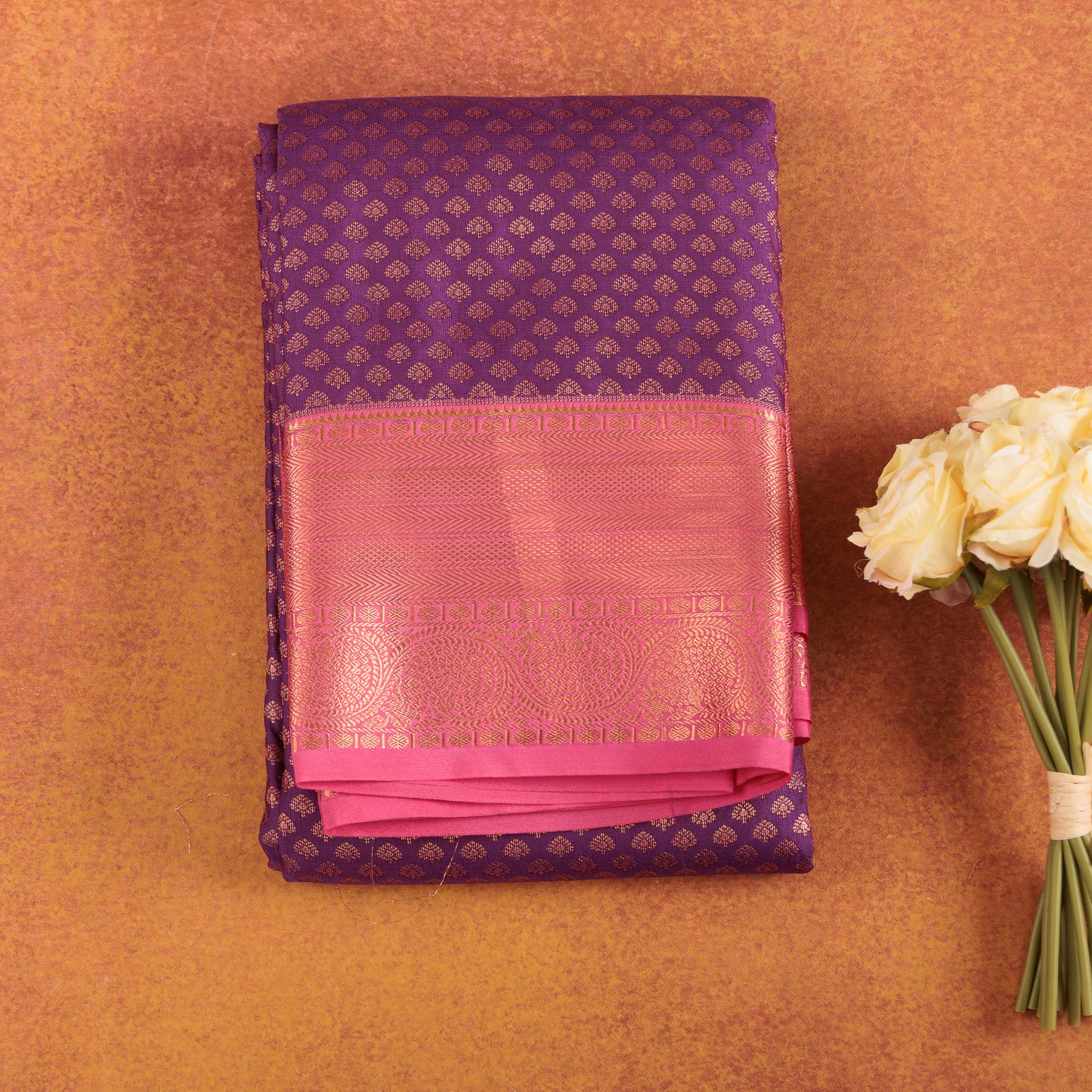 Lavender-kanjivaram-semi-silk-saree-with-pink-contrast-border-and-silver-elephant-motifs.