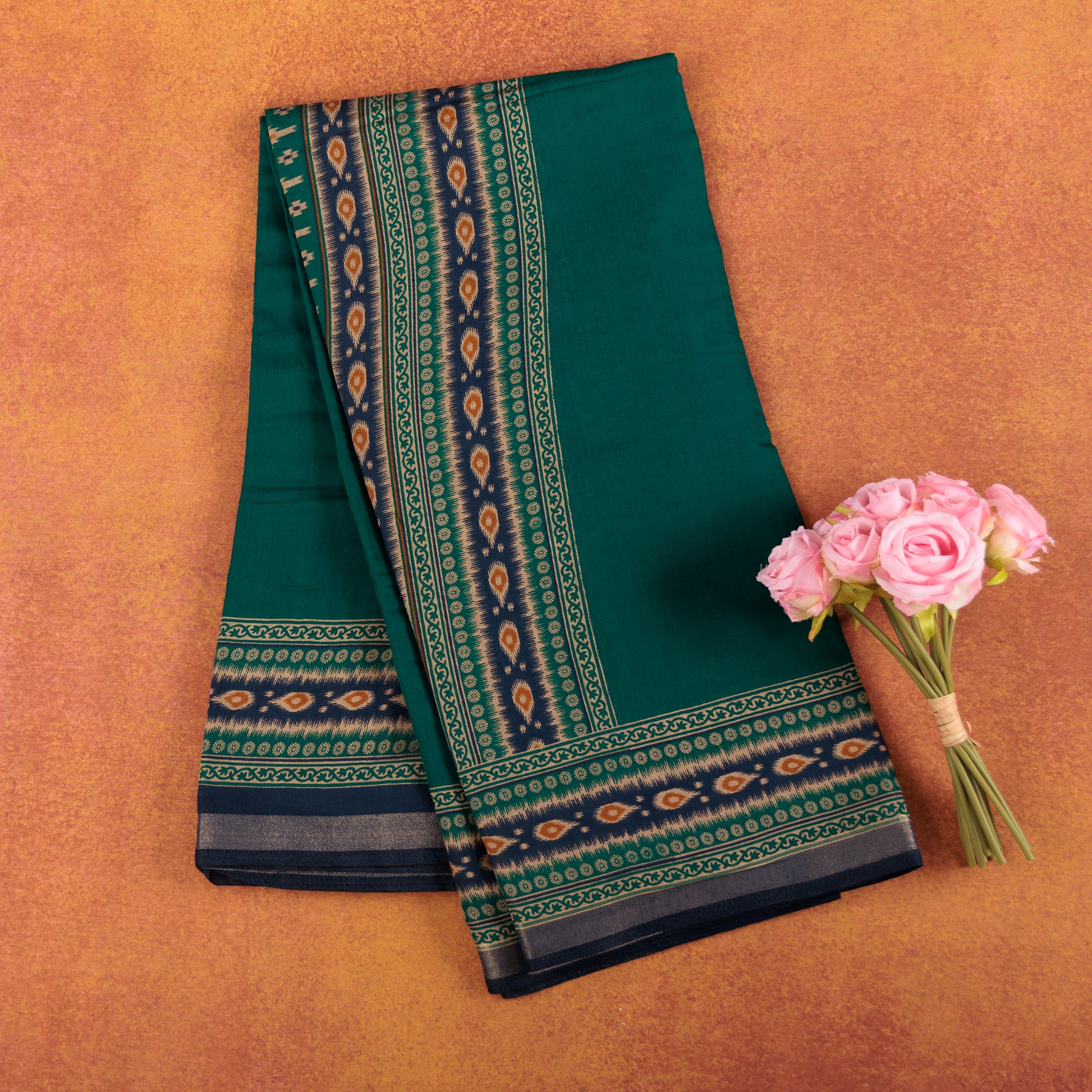 Emerald-green-soft-chanderi-cotton-silk-saree-with-traditional-gold-zari-printed-border.