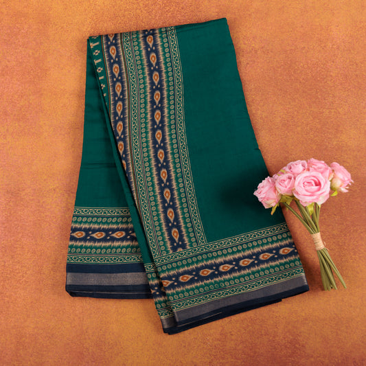 Emerald-green-soft-chanderi-cotton-silk-saree-with-traditional-gold-zari-printed-border.