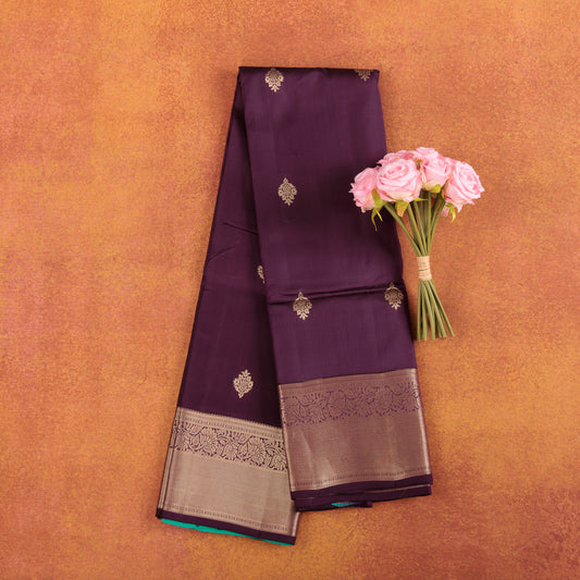 Deep-maroon-pure-kanjivaram-silk-saree-with-wide-gold-zari-border-and-roses.