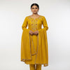 “Mustard yellow women’s stitched suit set with embroidered kurta, matching pants and dupatta, worn by model.”